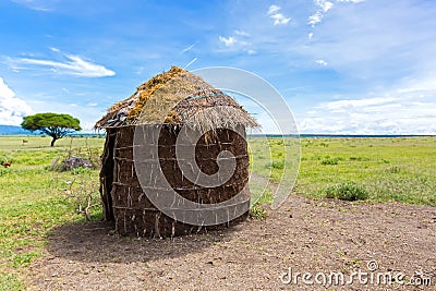 Maasai â€™s shelter, circular shaped thatch house made by women in Tanzania, East Africa Stock Photo